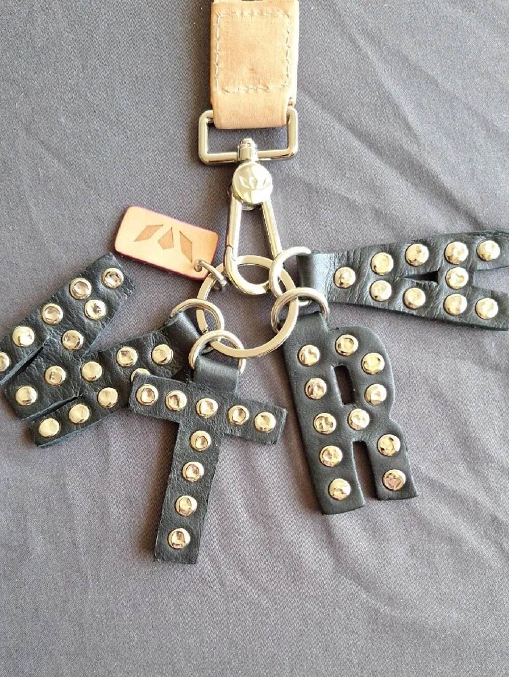 Consuela MTRA Black Studded Letter Bag Charm with Wrist Strap